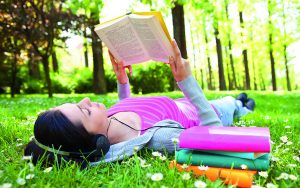 relaxing in nature with book and music